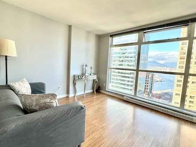 Downtown 1 Bed + Den Condo with Water Views