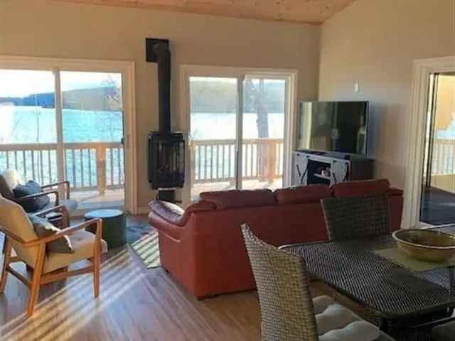 Beautifully Maintained Papineau Lake Cottage with Sandy Shoreline and Studio