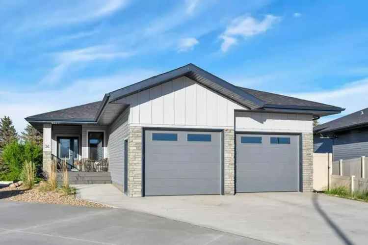 Buy Executive Walkout Bungalow in Lacombe with New Sunroom and Modern Features