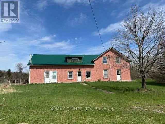 150 Acre Farm with Large Farmhouse and Outbuildings