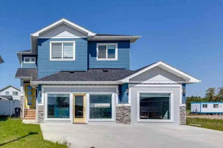 Luxury Former ShowHome with Triple Car Garage and 5-Piece Ensuite