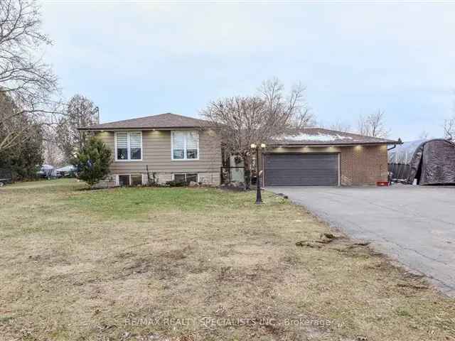 Prestige Industrial Acre Lot with Custom Bungalow and Finished Basement Apartment