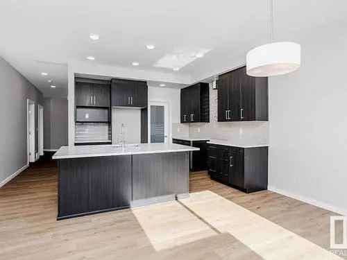 Buy modern 4 bedroom house in McConachie Edmonton with backyard