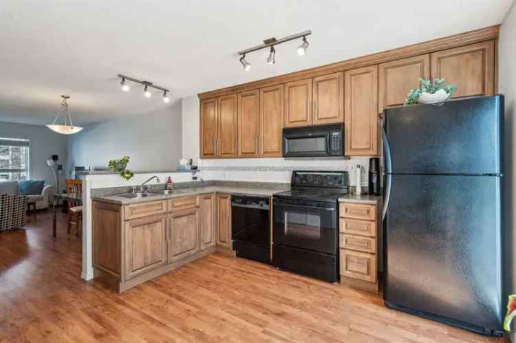 Move In Ready 2 Bed 2 Storey Townhome with Private Deck and Low Condo Fees