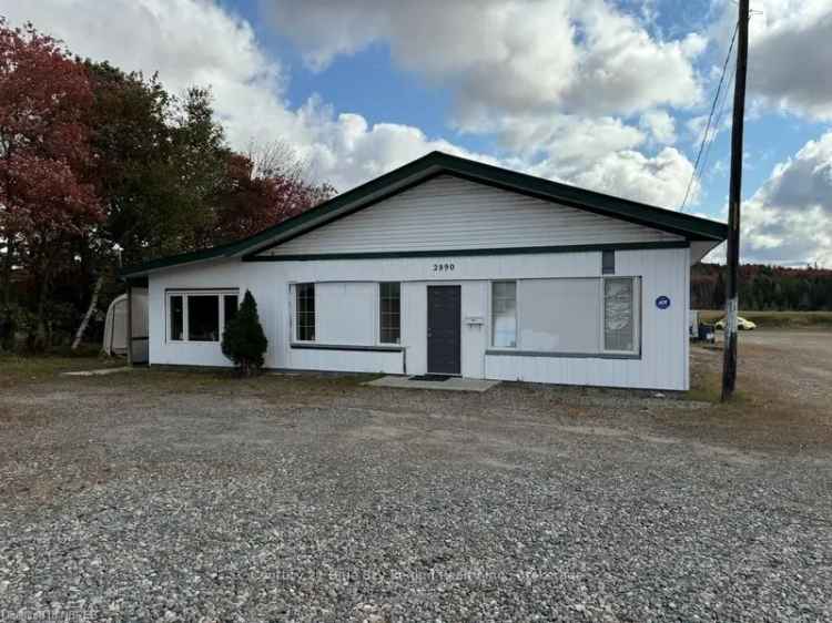 Mixed-Use Commercial Building with Apartment and Garage