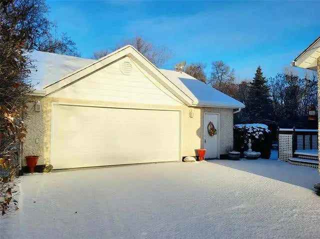 Stunning Selkirk Home with Amazing Curb Appeal and Oversized Garage