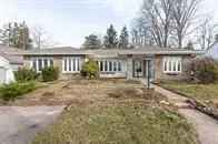 Buy bungalow in peaceful location with modern upgrades across from park