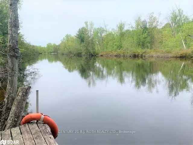 Half Acre Waterfront Lot on Black River - Septic, Dock, and Well