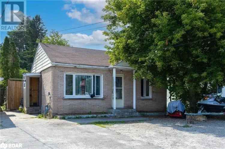 Charming Bungalow with C2 Zoning and Large Backyard