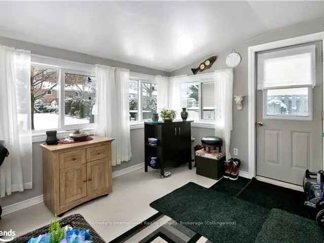 Charming 3-Bedroom Meaford Home with Sunroom and Park-Like Lot