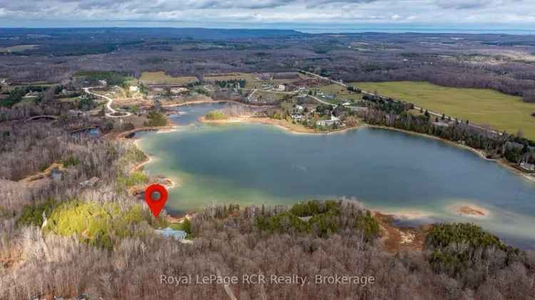 Bungalow for sale on Brewsters Lake with waterfront and shop