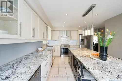 Spacious House for Sale in Barrie with Modern Kitchen and Fireplace