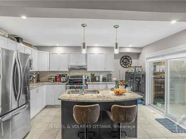 Move in Ready Home in Kanata Lakes with Gas Fireplace and Fenced Backyard