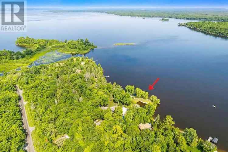 Buy waterfront home Ottawa River with gardens and boat dock