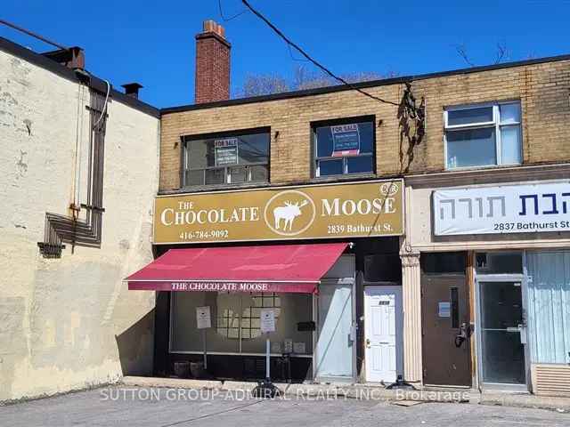 Retail Store with 2 Apartments - Great Investment Property