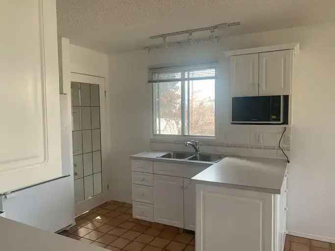 Cozy 3-Bedroom Main Floor Cochrane Near Downtown Schools Amenities