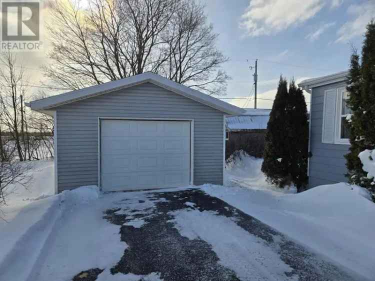 2-Bedroom Mini Home with Detached Garage and Updates