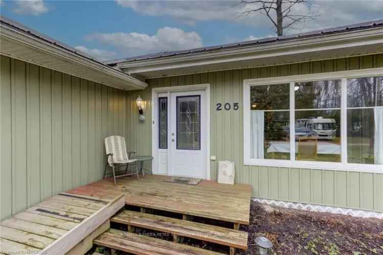 Buy bungalow near Lake Huron with beautiful backyard and garage