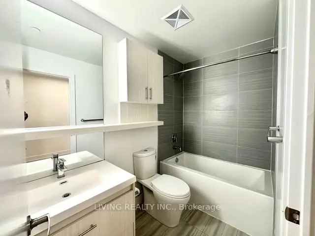 Fairview Mall Condo: 1 BR + Den, 2 Baths, Parking & Locker