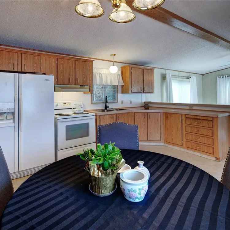 For Sale Manufactured Home in Upper Lantzville with Garden Space