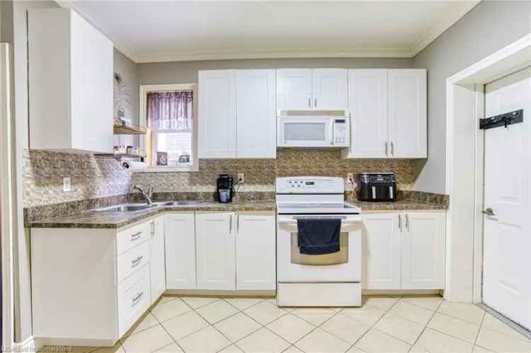 Buy duplex in Hamilton with spacious kitchen and main floor laundry