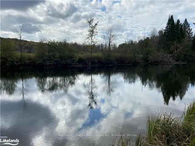 Half Acre Waterfront Lot with Damaged Cottage - As Is