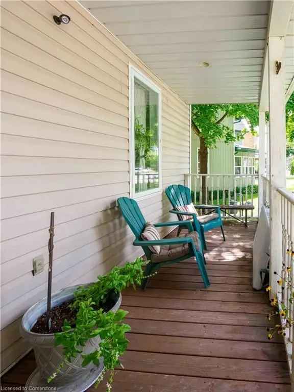 Buy charming century old home in Jarvis with spacious yard and porch