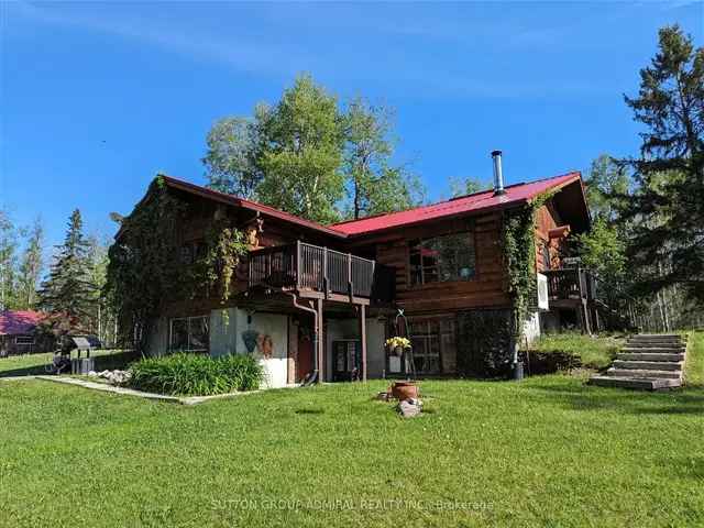 16.7 Acre Log House with 4-Stall Barn and Storage Sheds