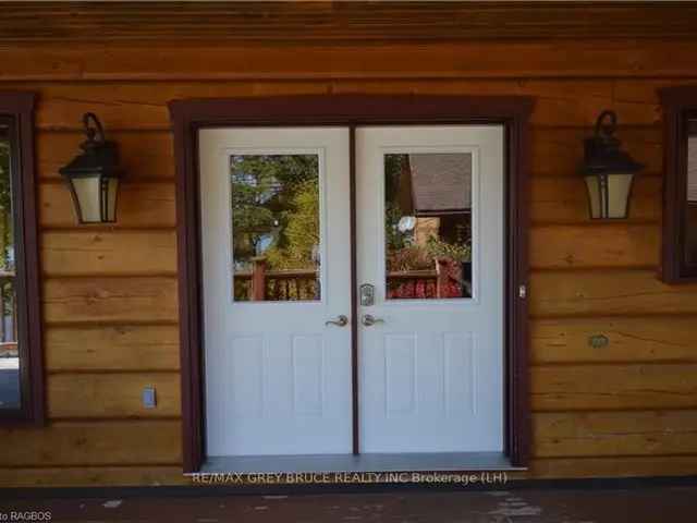 Two Storey Waterfront Log Home on Miller Lake