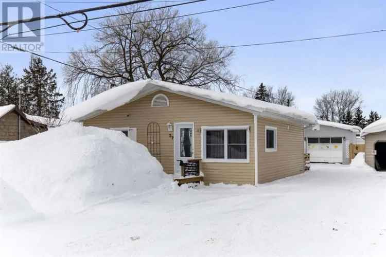 27 Elmwood Avenue Bungalow: Updated 2-Bedroom Home with Detached Garage