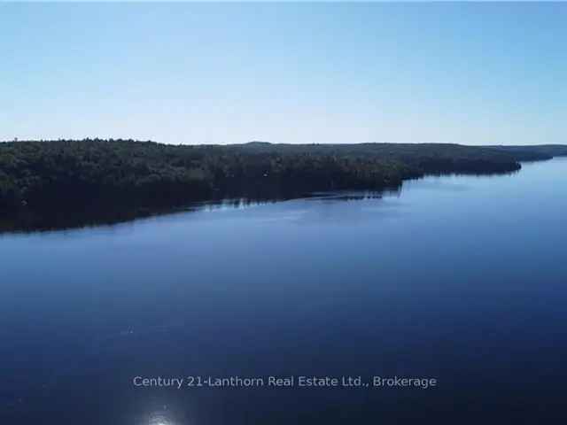 8-Acre Mazinaw Lake View Property with Pond and Trails