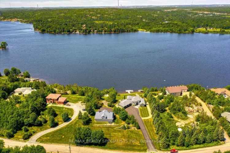 Buy luxurious waterfront estate in Mcfarlane Lake with stunning views