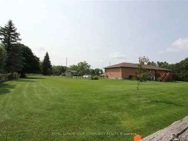 4.56 Acre Ranch Bungalow with Oversized Garage and Finished Basement