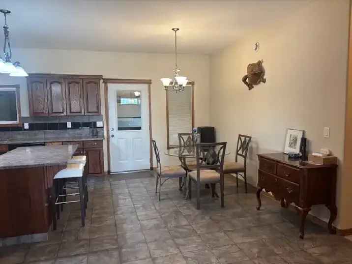 Lacombe Bilevel Home with 1200 Sqft Heated Shop & Double Garage