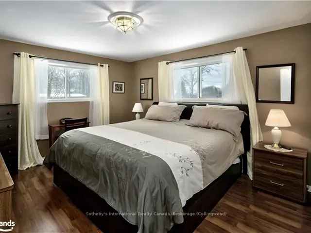 Charming 3-Bedroom Meaford Home with Sunroom and Park-like Lot