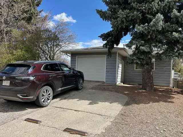 3 Bedroom Bungalow with Basement Suite and Sheds