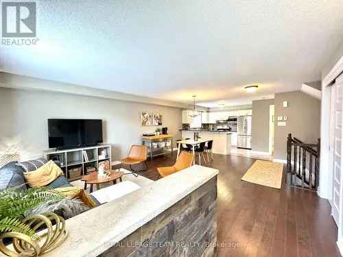 Townhouse for Sale in Orleans: 3-Bedroom End Unit with Private Terrace