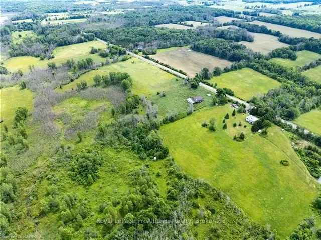 94 Acre Property with 1850s Farmhouse - Privacy and Potential