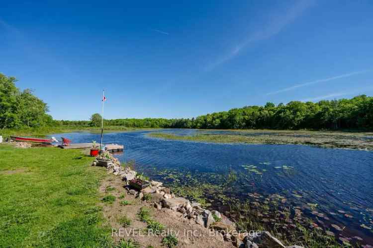 10-Acre Waterfront Log Home with Shop and Extensive Tools