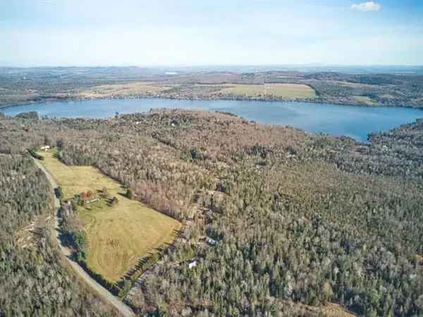 65+ Acre Magog Bungalow with Mountain Views Subdivision Potential