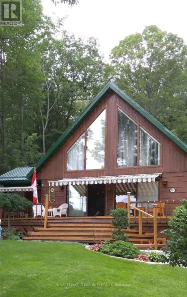 Buy Log Home in Campbellford with Water Views and Spacious Living Areas