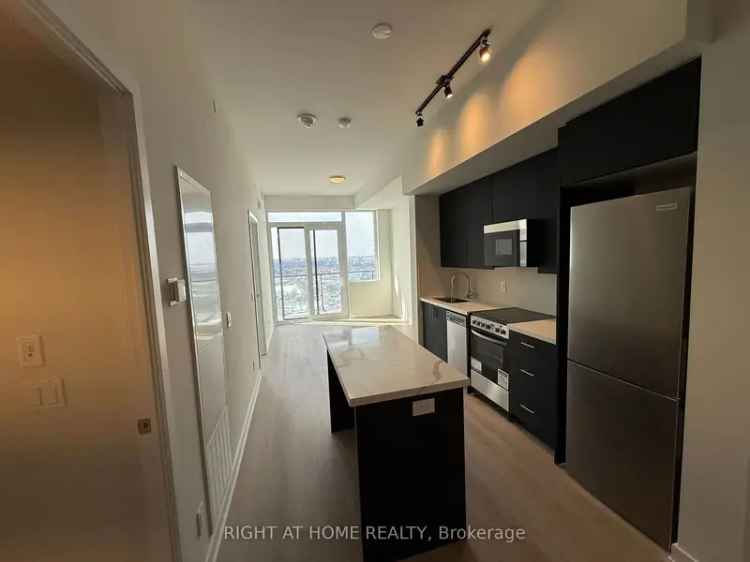 Luxury 1-Bedroom + Den Lower Penthouse Suite with Balcony