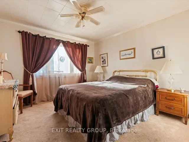 4-Bedroom Bungalow with Hardwood Floors Gas Fireplaces and Large Backyard