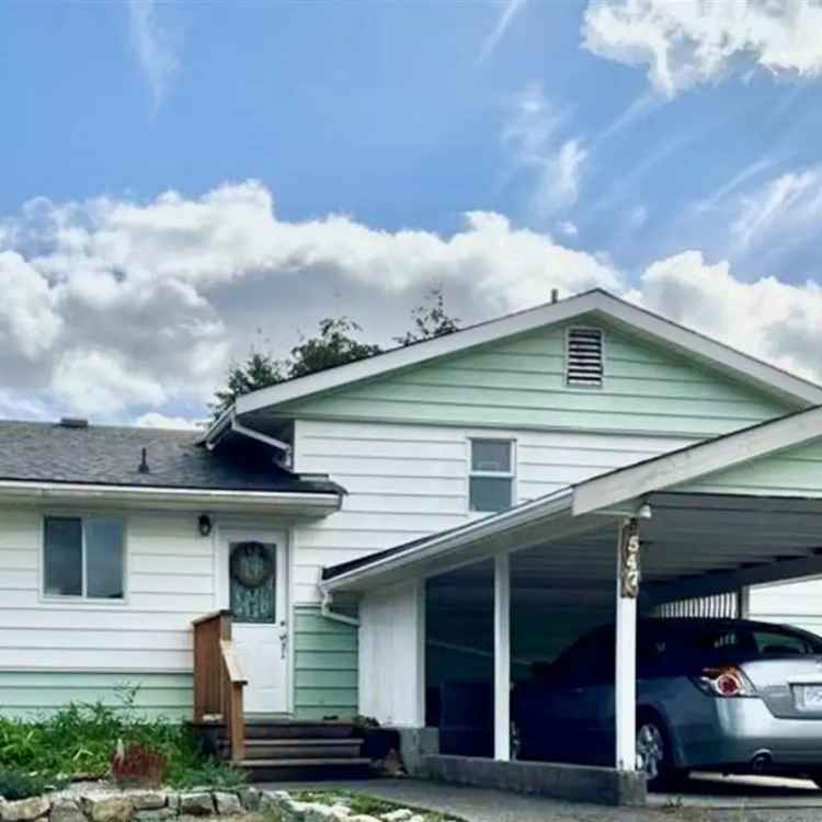 House for Sale: Hilltop Home with Mountain Views and River Access