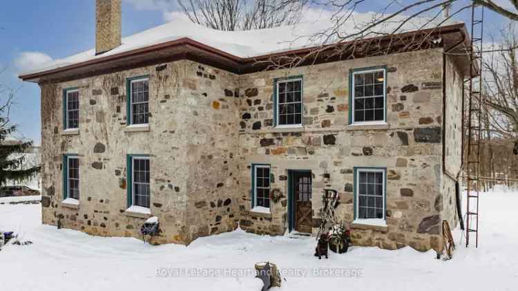 1853 Stone Century Home on 7.35 Acres with Riverfront and Shop