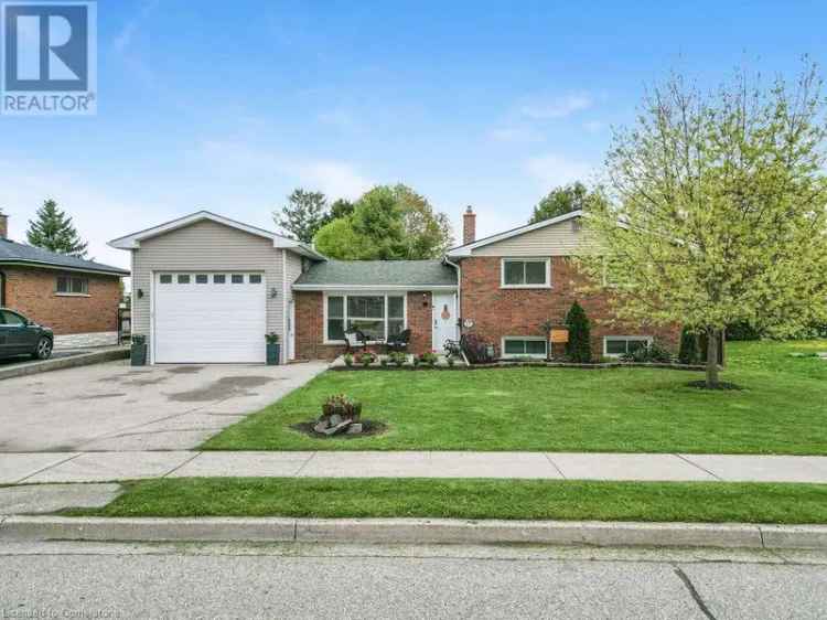 3 Level Side Split Home with 972 Sq Ft Drive Through Garage