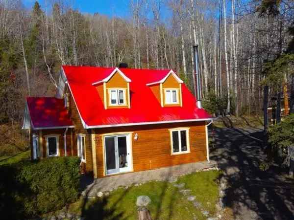 Two-Storey House for Sale in Charlevoix with River View
