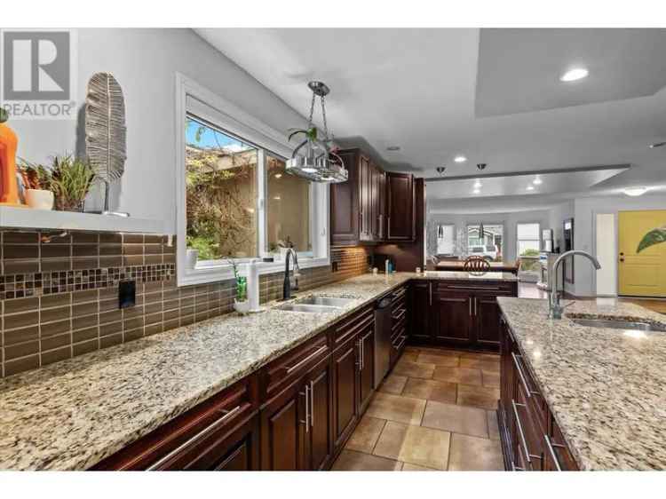 Buy Walkout Rancher in Lower Mission with Chef Kitchen and Yard Features