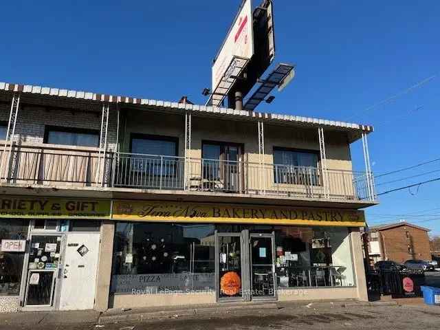 Invest in Dufferin St Corner Store with Full Basement and Income Potential