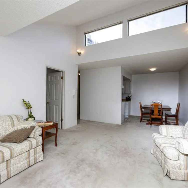 Central Lonsdale Gem: Bright 1 Bed + Balcony Suite
